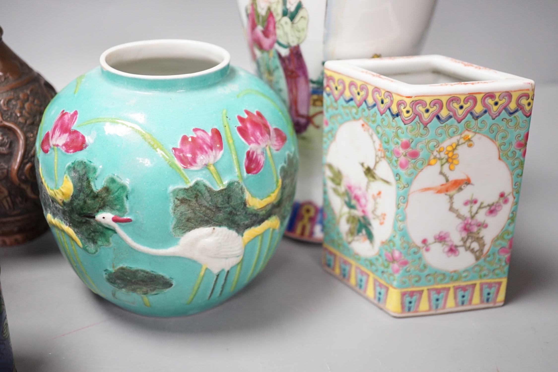 A group of Chinese porcelain vases, a cloisonné enamel vase and pot and a Middle Eastern metal vase, tallest 23 cm